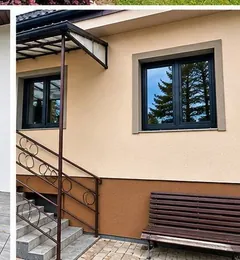 Ciemne okna w beżowej elewacji przy schodach wejściowych.